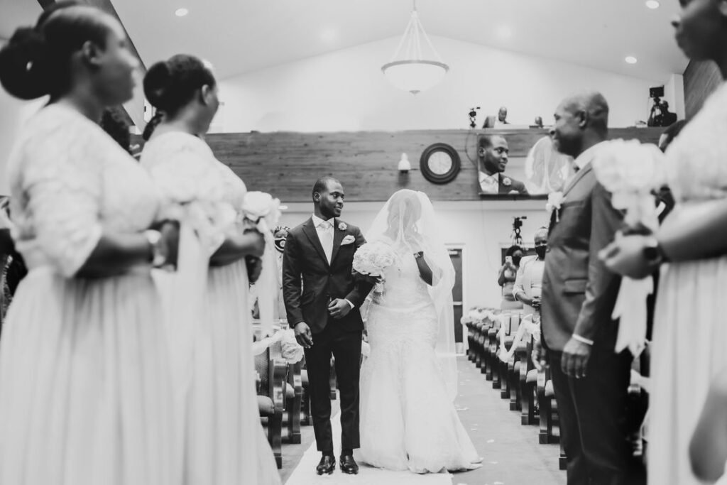 Bride and groom walking down the aisle