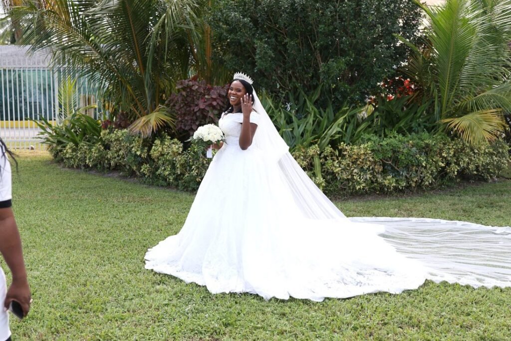 Bride walking through a garden venue